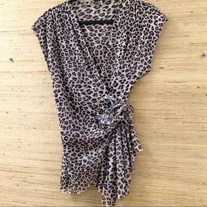 Adorable Leopard lace mesh top with flowers on the side.